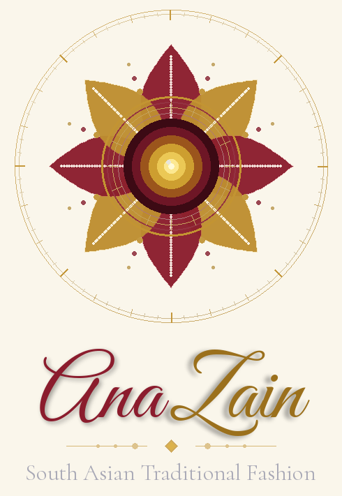 Clean background inside the ring, rich layered jewel center, detailed zari spoke work, elegant corner accents, and the "AnaZain" script flows beautifully beneath it all.